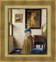 「ヴァーナルの前に立つ女」 A Young Woman Standing at a Virginal 2011年制作・ジクレー版画 本作品は1670〜72年頃に描かれた 油彩をジクレーにて復刻したもの。 似た主題の『ヴァージナルの前に座る女』と ともに晩年の作品と見なされている。 左方の窓から光の入る室内という設定は おなじみのものだが、この作品では、 室内全体が明るく照らされていることと、 女性が光に背を向けて立っている点が 他の作品と異なっている。 背景の画中画はトランプの「1」の 女性の愛がただ一人の人にのみ向けられる べきものであることを意味している。 同じ画中画は『中断された音楽の稽古』にも 見られる。室内の壁の一番下、 床との境目の部分には白地に青の模様の 入ったデルフト焼きのタイルが貼られている。 これは壁のこの部分が掃除の時などに 傷むのを防ぐためのものである。 ◆この作品は受注制作なので、お届けまでに 　4週間いただいております。 技法 ジクレー版画2011年制作：Fort・gang工房 額装サイズ 69×62.5cm 　 絵柄サイズ 50.2×43.8cm97% 収蔵 ロンドン・ナショナルギャラリー 注意 画面上と実物では多少色具合が異なって見える場合もございます。ご了承ください。 　 壁掛け用金具（専用ひも付き）重さに合わせて、お付けします。 木製額（金装飾すりだし仕上げ）版画は大変お求めやすく、卒業、入学、引越し、新築、誕生、結婚、出産と 様々なお祝い事のギフト・プレゼントとして喜ばれます。