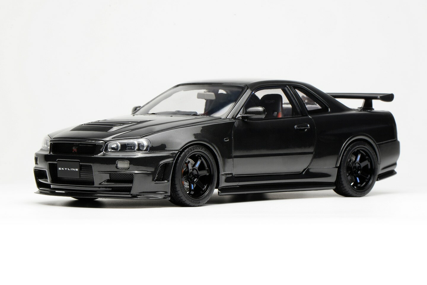 Rakuten - MotorHelix モーターヘリックス 1/18 ミニカー ダイキャストモデル 2002年モデル 日産 NISSAN SKYLINE GT-R (R34) Cutomized Version Carbon Fiber カーボンブラック