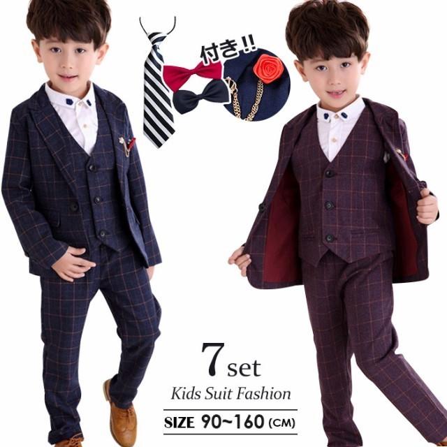 素材 綿、ポリエステルセット内容 7点セット（ベスト+ジャケット+ズボン+シャツ+蝶ネクタイ+赤いブロート+ネクタイ）カラー展開 【パープル】【ブルー】サイズ展開 【90】【100】【110】【120】【130】【140】【150】【160】安心保障 ●7日間!!サイズ・カラー交換OK♪　　・到着日から7日間対応致します。　　・在庫がある商品に限ります。　　・出荷時・返送時送料はお客様負担となります。●7日間、返品OK◎　　※イメージ違いによる返品も可　　・到着日から7日間対応致します。　　・出荷時・返送時送料はお客様負担となります。●365日間、品質保証!!　　・到着日から365日間対応致します。　　・商品の返品・交換を承ります。　　・袋やタグが無くても対応致します。※お客様都合の返品・交換はすべて未使用品に限ります。商品の在庫はシステム更新のタイミングにより、極稀に品切にも 関わらず受注してしまう恐れがあります。予めご了承下さい。 ■　商　品　説　明　■ カラー 【パープル】【ネイビー】 材質 綿、ポリエステル 7点セット 100cm-170cm 7点セット・ジャケット・ベスト・ズボン・シャツ・蝶ネクタイ・ネクタイ・赤いプローチ 商品内容 ・キッズスーツ フォーマル 男の子 長袖 子供服 フォーマル 男の子 ピアノ発表会 男の子・七五三 男の子 スーツ 韓国 子供服 入学式 ジュニア　結婚式　スーツ　男の子・着心地や肌触りの良い物を選びました。・かっこよくコスパの良い物を選びました。・通気性に優れた生地でさらっと快適。・全体的にスタイルアップ出来るオシャレな1着です♪・格好いい大人っぽいキッズ四季フォマール服装!・七五三や卒入学式、発表会、ちょっとしたお出かけや、冠婚葬祭までオールマイティーに使えるスーツセット。・履き心地が良い生地も柔らかく、子供にストレスを与えない動きやすさ。・普通着としてもお洒落で、卒入学式、発表会、冠婚葬祭など正式な場も活躍1枚です。・肌触り良く、デザインもすっきりしていて良かったです。・卒園式、入学式、発表会など大切な式だけでなく、お食事会やお出かけにも気負いなく着ることができます！ ご注意 ※サイトに掲載されている商品は、モニター環境により実際のものと素材感が 若干異なって見える場合がございます。※加工具合により掲載画像との誤差が見られる場合もございます。予めご了承くださいますようお願い申し上げます。 即納 子供スーツ お得7点セット チェック柄 シャツあり 男の子スーツ 七五三 フォーマル 子供服 紳士服 キッズ ジュニア 入園式 卒園式 入学式 卒業式 発表会
