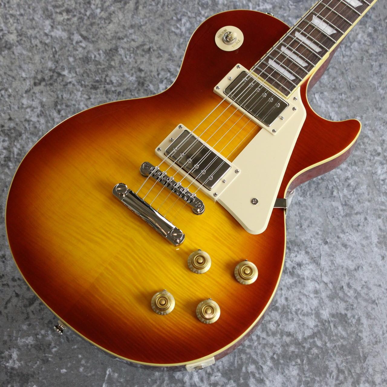 エレキギター永遠のスタンダードの1つ。 Les Paul Standardが本家直系Epiphoneより入荷いたしました。 ファット＆メロウなサウンドは王道ロックからブルージーなプレイ、 そして艶のあるクリーンまで幅広く対応可能です。 以下公式サイトより A 50s Classic, Reborn エピフォン・レスポール・スタンダード 50s は、エピフォン“Inspired by Gibson”コレクションを代表する1本です。1950年代製のレスポールのフィーリングとトーンが見事なまでに再現されています。 エピフォンとレス・ポール氏（偉大なギタリスト〜ミュージシャンであり発明家！！）の長い友情関係は1940年にまで遡ります。若きレス・ポール氏は、当時マンハッタンにあったエピフォン工房で夜な夜な試作を重ね、世界初のソリッドボディ・エレクトリックギターのひとつと言われる"the Log"を作り上げました。そして"the Log”での成果が後々、今日も多くのギタープレイヤーにとって最上のエレクトリックギターとして垂涎の的である、レスポール・モデルの開発・誕生へと反映されていったのです。 ボディ・トップにはメイプルが貼られ、上面にはAAA グレードのフレイム・メイプル化粧板があしらわれています。1959ラウンド・ミディアム・Cシェイプのネックにはバインディングが施され、ロング・ネック・テノン方式でボディにジョイントされています。ローレル指板にはクラシカルなディッシュ・インレイが施され、カラマズー・ヘッドストックにはヴィンテージ・デラックス・チューナーを搭載。電装系には定評のある2基のProbucker?ハムバッカー・ピックアップ、ダイヤル・ポインタ付きのゴールド・トップハット・ノブを採用。Graph Tech?ナット、CTSポット、往時の製法に則った配線など、拘りの仕様群により魅力が一層高められています。Epiphoneプレミアム・ギグバッグが付属となります。 BODY Body Style : Les Paul Body Shape : Les Paul Body Material : Okoume (Gaboon Mahogany) or Sapelli (Sapelli Mahogany) Top : Maple Cap with AAA Flame Maple Veneer Binding : Single Ply Cream; Top and Fretboard Body Finish : Gloss NECK Profile : 1959 Rounded Medium C Scale Length : 628.65 mm / 24.75 in Fingerboard Material : Laurel Fingerboard Radius : 304.8 mm / 12 in Neck Material : Mahogany Fret Count : 22 Frets : Medium Jumbo Nut Material : Graph Tech Nut Width : 43.0 mm / 1.692 in Inlays : Pearloid Trapezoid Joint : Glued In, Set Neck; Long Tenon HARDWARE Finish : Nickel Bridge : Epiphone LockTone Tune-O-Matic Tailpiece : Epiphone LockTone Stop Bar Tuning Machines : Epiphone Vintage Deluxe Pickguard : Cream Truss Rod : Dual Action Truss Rod Cover : 2-ply Black Bell; "Standard" Control Knobs : Gold Top Hat with Dial Pointer Switch Tip : Cream Switch washer : Cream with Gold Text Jack Plate Cover : Cream Plastic Square Control Covers : Black Strap Buttons : 2 - Bottom and Upper Bout Mounting Rings : Cream Pickup Covers : Nickel ELECTRONICS Neck Pickup : Epiphone Probucker 1 Bridge Pickup : Epiphone Probucker 2 Controls : 2 Volume, 2 Tone; CTS Potentiometers and 50s Wiring Pickup Selector : 3-way Toggle Output Jack : 1/4" Strings Gauge : .010, .013, .017, .026, .036, .046 Case : Premium Gig Bag ※撮影機材の性能や、お使いの画面環境によって実物と色味が異なって映ることがございます。 予めご了承をお願いいたします。 【選べる豊富な決済方法】 クレジットカード決済/銀行振込/代引き/ショッピングクレジット --------------- 【ショッピングクレジット無金利＆超低金利キャンペーン】 48回払いまで金利手数料0%!!　 [ 54回 1%／60回 2% ／84回 5% ] ※各種分割払い(クレジットカード、ショッピングクレジット)ご利用いただけます。 詳しくはお電話もしくはメールにてお気軽にお問合せくださいませ。 --------------- 【買取・下取り、試奏、ご購入を検討の方】 (株)黒澤楽器店 お茶の水駅前店新館1F 東京都千代田区神田駿河台2-2-2 TEL：03-3293-5625 MAIL：eki@kurosawagakki.com 営業時間:11:00〜20:00(年中無休)