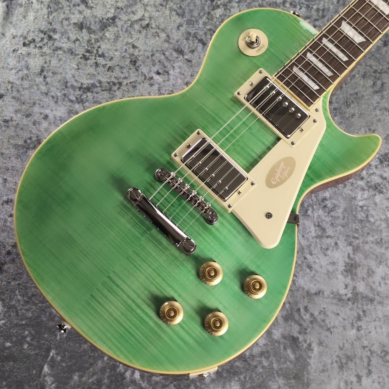 エレキギター永遠のスタンダードの1つ。 Les Paul Standardが本家直系Epiphoneより入荷いたしました。 ファット＆メロウなサウンドは王道ロックからブルージーなプレイ、 そして艶のあるクリーンまで幅広く対応可能です。 以下公式サイトより A 50s Classic, Reborn エピフォン・レスポール・スタンダード 50s は、エピフォン“Inspired by Gibson”コレクションを代表する1本です。1950年代製のレスポールのフィーリングとトーンが見事なまでに再現されています。 エピフォンとレス・ポール氏（偉大なギタリスト〜ミュージシャンであり発明家！！）の長い友情関係は1940年にまで遡ります。若きレス・ポール氏は、当時マンハッタンにあったエピフォン工房で夜な夜な試作を重ね、世界初のソリッドボディ・エレクトリックギターのひとつと言われる"the Log"を作り上げました。そして"the Log”での成果が後々、今日も多くのギタープレイヤーにとって最上のエレクトリックギターとして垂涎の的である、レスポール・モデルの開発・誕生へと反映されていったのです。 ボディ・トップにはメイプルが貼られ、上面にはAAA グレードのフレイム・メイプル化粧板があしらわれています。1959ラウンド・ミディアム・Cシェイプのネックにはバインディングが施され、ロング・ネック・テノン方式でボディにジョイントされています。ローレル指板にはクラシカルなディッシュ・インレイが施され、カラマズー・ヘッドストックにはヴィンテージ・デラックス・チューナーを搭載。電装系には定評のある2基のProbucker?ハムバッカー・ピックアップ、ダイヤル・ポインタ付きのゴールド・トップハット・ノブを採用。Graph Tech?ナット、CTSポット、往時の製法に則った配線など、拘りの仕様群により魅力が一層高められています。Epiphoneプレミアム・ギグバッグが付属となります。 BODY Body Style : Les Paul Body Shape : Les Paul Body Material : Okoume (Gaboon Mahogany) or Sapelli (Sapelli Mahogany) Top : Maple Cap with AAA Flame Maple Veneer Binding : Single Ply Cream; Top and Fretboard Body Finish : Gloss NECK Profile : 1959 Rounded Medium C Scale Length : 628.65 mm / 24.75 in Fingerboard Material : Laurel Fingerboard Radius : 304.8 mm / 12 in Neck Material : Mahogany Fret Count : 22 Frets : Medium Jumbo Nut Material : Graph Tech Nut Width : 43.0 mm / 1.692 in Inlays : Pearloid Trapezoid Joint : Glued In, Set Neck; Long Tenon HARDWARE Finish : Nickel Bridge : Epiphone LockTone Tune-O-Matic Tailpiece : Epiphone LockTone Stop Bar Tuning Machines : Epiphone Vintage Deluxe Pickguard : Cream Truss Rod : Dual Action Truss Rod Cover : 2-ply Black Bell; "Standard" Control Knobs : Gold Top Hat with Dial Pointer Switch Tip : Cream Switch washer : Cream with Gold Text Jack Plate Cover : Cream Plastic Square Control Covers : Black Strap Buttons : 2 - Bottom and Upper Bout Mounting Rings : Cream Pickup Covers : Nickel ELECTRONICS Neck Pickup : Epiphone Probucker 1 Bridge Pickup : Epiphone Probucker 2 Controls : 2 Volume, 2 Tone; CTS Potentiometers and 50s Wiring Pickup Selector : 3-way Toggle Output Jack : 1/4" Strings Gauge : .010, .013, .017, .026, .036, .046 Case : Premium Gig Bag ※撮影機材の性能や、お使いの画面環境によって実物と色味が異なって映ることがございます。 予めご了承をお願いいたします。 【選べる豊富な決済方法】 クレジットカード決済/銀行振込/代引き/ショッピングクレジット --------------- 【ショッピングクレジット無金利＆超低金利キャンペーン】 48回払いまで金利手数料0%!!　 [ 54回 1%／60回 2% ／84回 5% ] ※各種分割払い(クレジットカード、ショッピングクレジット)ご利用いただけます。 詳しくはお電話もしくはメールにてお気軽にお問合せくださいませ。 --------------- 【買取・下取り、試奏、ご購入を検討の方】 (株)黒澤楽器店 お茶の水駅前店新館1F 東京都千代田区神田駿河台2-2-2 TEL：03-3293-5625 MAIL：eki@kurosawagakki.com 営業時間:11:00〜20:00(年中無休)