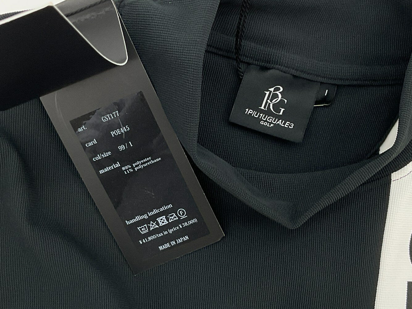 1PIU1UGUALE3　GOLF 1 ブラック×ホワイト CHEST SWITCHED S/S POLO　バイカラーロゴ半袖ポロ