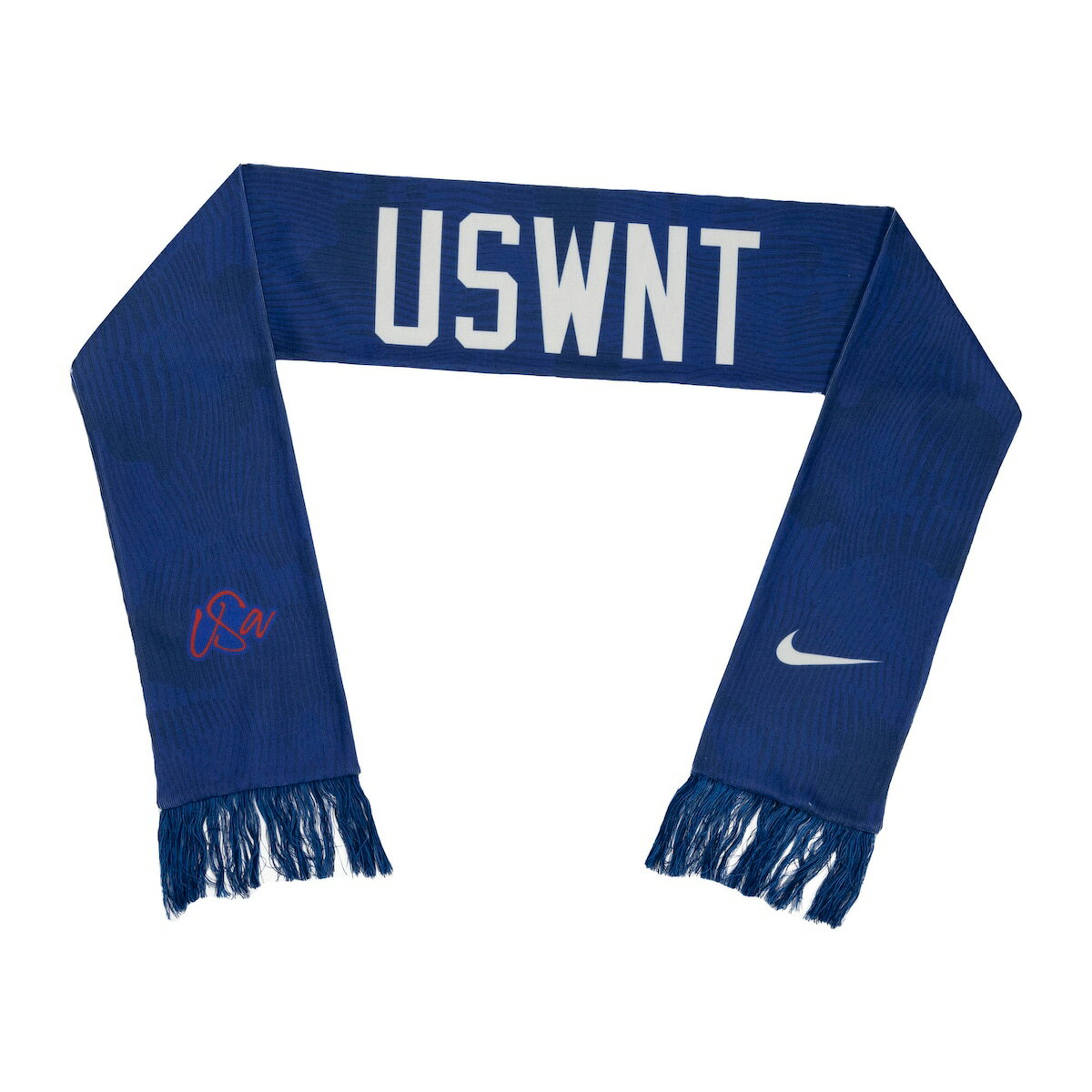 Show your devotion to the USWNT with this fashionable Local Verbiage scarf from Nike. It features double-sided graphics and fringe on both ends for added USWNT flair. This scarf makes the perfect accent for any game day outfit thanks to its soft fabric and fun design.Embroidered fabric appliqueHand wash, line dryOfficially licensedWoven graphicsDouble-sided design differs per sideImportedBrand: NikeMaterial: 100% AcrylicMeasures approx. 66'' including fringe x 6.5''Fringe ends