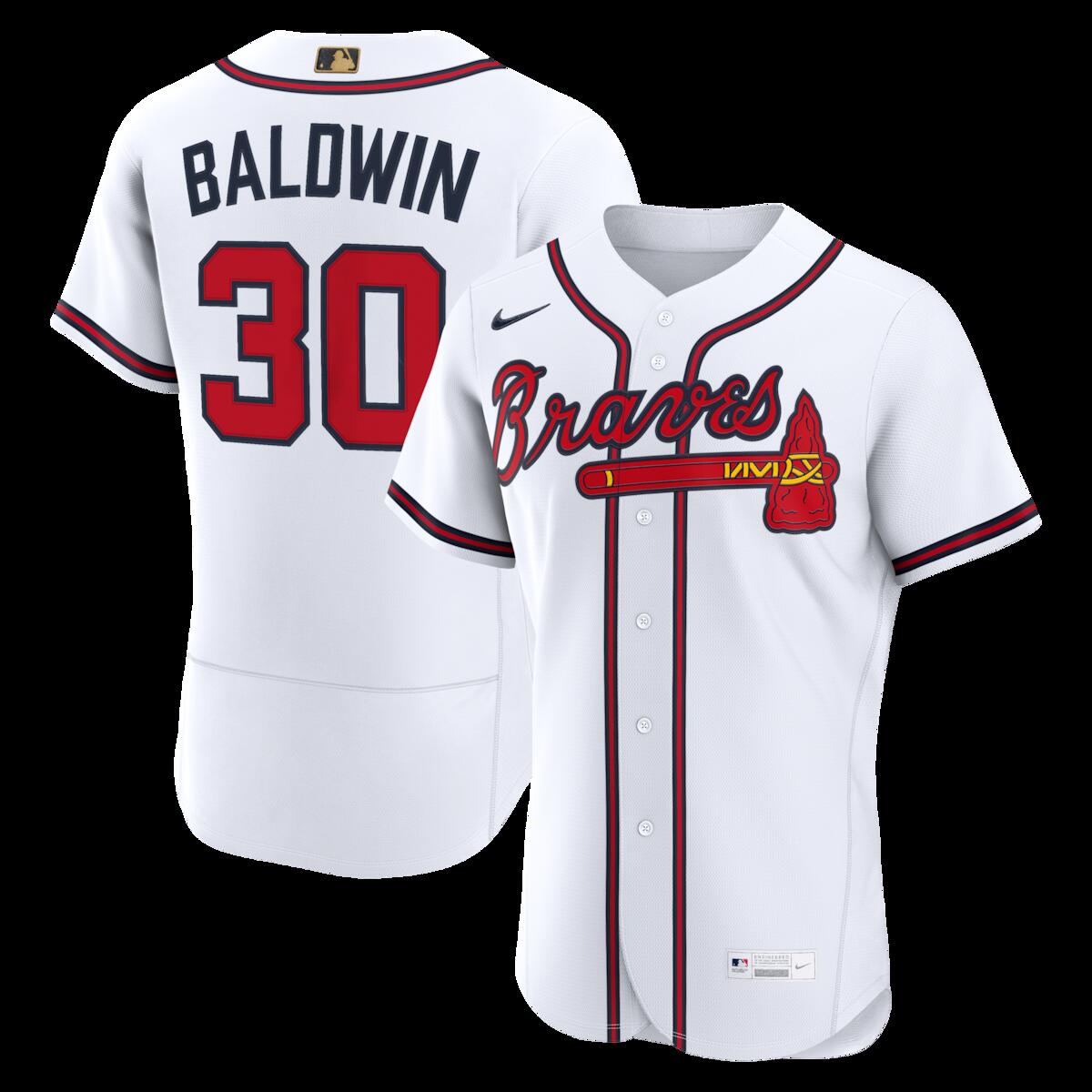 Commemorate a legendary season with the Drake Baldwin Authentic Jersey. This jersey features the exclusive gold MLB logo on the back neck, a prestigious detail introduced to honor the league's standout 2025 award winners. Built to the exact on-field specifications of the pros, the Nike jersey delivers the same high-performance fabric and athletic fit used in the dugout. It is the ultimate piece for any fan looking to own the genuine gear worn by the game's best.MLB Authentic Jersey: A true collector's piece and exactly what the players wear on the fieldAuthenticBrand: NikeStandard Fit: Not too tight or loose over your body.Made in the USADesigned with a longer length that can be tucked into pants. Jersey length ranges from 33" (Size 40) to 35 1/2" (Size 60).Officially licensedRecycled woven Nike Swoosh, front jock tag, neck label and center back neck MLB Batterman logoMachine wash cold with like colors,inside out. Gentle cycle. Line dry.Breathable mesh side and back panelsMoisture-wicking technology keeps you cool and drySewn-down sleeve patch and player name and numbers, where applicableJersey Color Style: HomeFull or left chest recycled tackle twill team wordmarkMaterial: 100% Polyester Mock Mesh