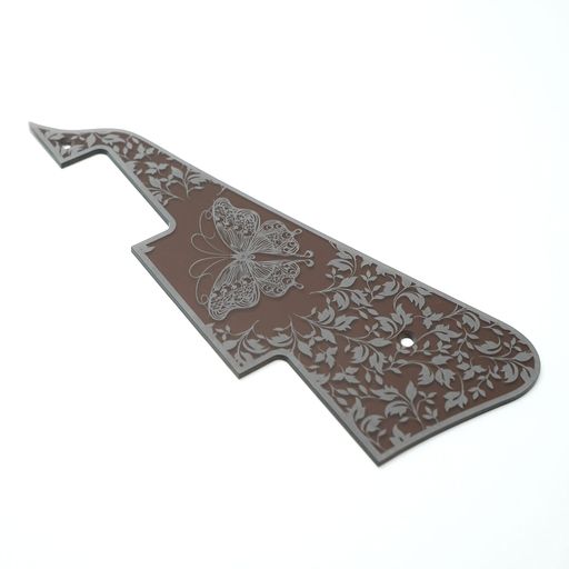 セピアカラーの透明アクリルに彫刻を施したレスポール用ピックガードです。 Gibson純正のレスポールからトレースしておりますが、楽器の個体差によるずれが生じる場合があることをご了承下さい。 アクリルの厚みは2mm。