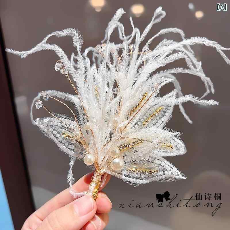・カテゴリ: ヘアアクセサリー・対象: 子供・素材: 合金・種類: 発夹、发卡・流行要素: 蝶結び・カラー展開: 大型羽毛ヘアクリップ1個、小型羽毛ヘアクリップ1個、羽毛ヘアクリップ2個左右無し