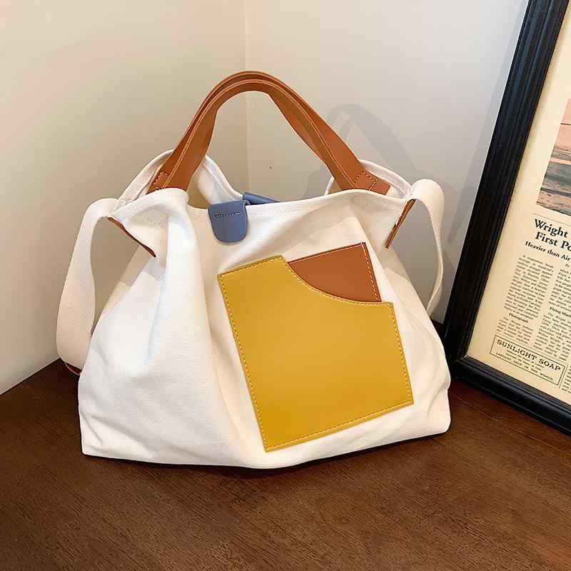 ・スタイル: 街頭潮流・主な素材: 帆布・カテゴリ: トートバッグ・サイズ: 大・流行要素: 撞色・形状: 横型方形・開閉方式: 磁扣・内部構造: 携帯袋・硬さ: 柔らかい・外ポケット: オープンタイプ・肩紐: 2本・使用シーン: 日常使い