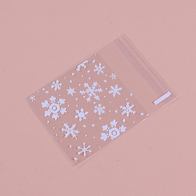 Meltryllis ラッピング袋 透明セルフシール OPPバッグ 100枚入り 雪の結晶デザイン 個包装 お菓子 パン..