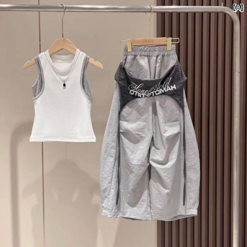 ・カテゴリ: 童セット・スタイル: 韓国風・セット内容: トップス+ボトムス・対象年齢: 8歳以上・対象身長: 140cm以上・対象季節: 夏・袖丈: ノースリーブ・フード: フードなし・パンツ丈: ロング・素材加工: 柔軟加工・厚み: 薄手・柄: 無地・主な素材: ポリエステル100%・トップス形状: プルオーバー・カラー展開: フェイクツーピースタンクトップ+グレーオーバーレイコンバットパンツ,フェイクツーピースタンクトップ+グレーオーバーレイスカート,フェイクツーピースタンクトップ,グレーオーバーレイコンバットパンツ,グレーオーバーレイスカート・サイズ展開: 120cm,130cm,140cm,150cm,160cm,170cm・要素: スポーツ,セットアップ