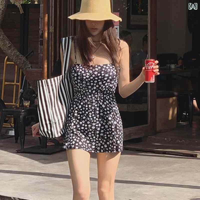 源 工場の 韓国 版の 新型 ins 風の ガーターの 花の ワンピースの 水着の 女性は 胸を 拭いて 腰を 収めて やせて いる 温泉の 水着を 現します。