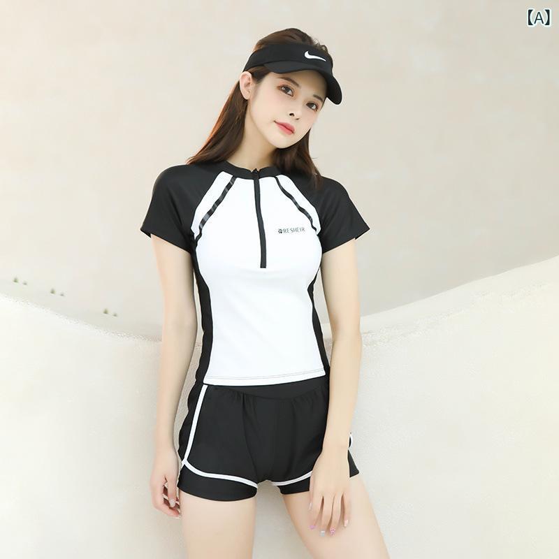 水着の 女性の 新型は 腹の 肉を 遮って やせて います。