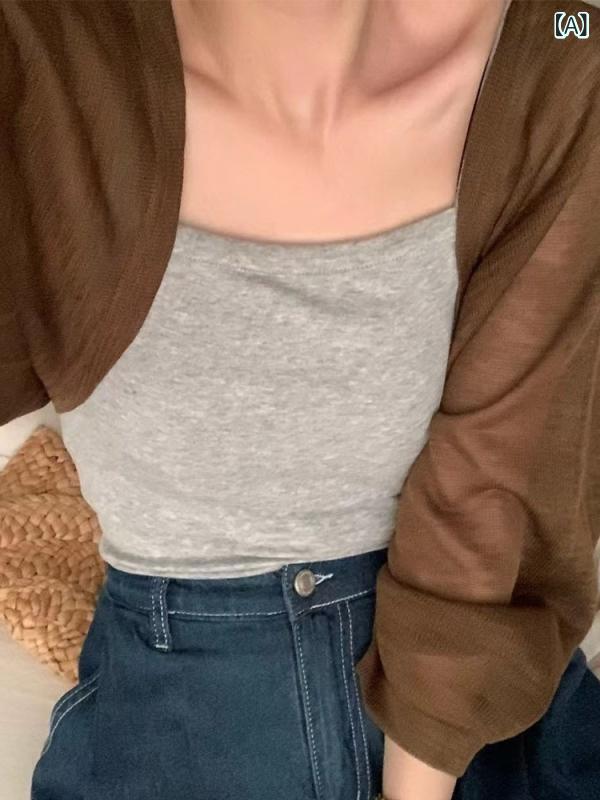 フランスの小さな カンカンの 肩の 氷の 糸の ニットの 日焼け 止めの カーディガンの 女性の 薄い タイプの マントの 初春は サスペンダーの スカートの 外で 上着の ブラウスを 掛けます。