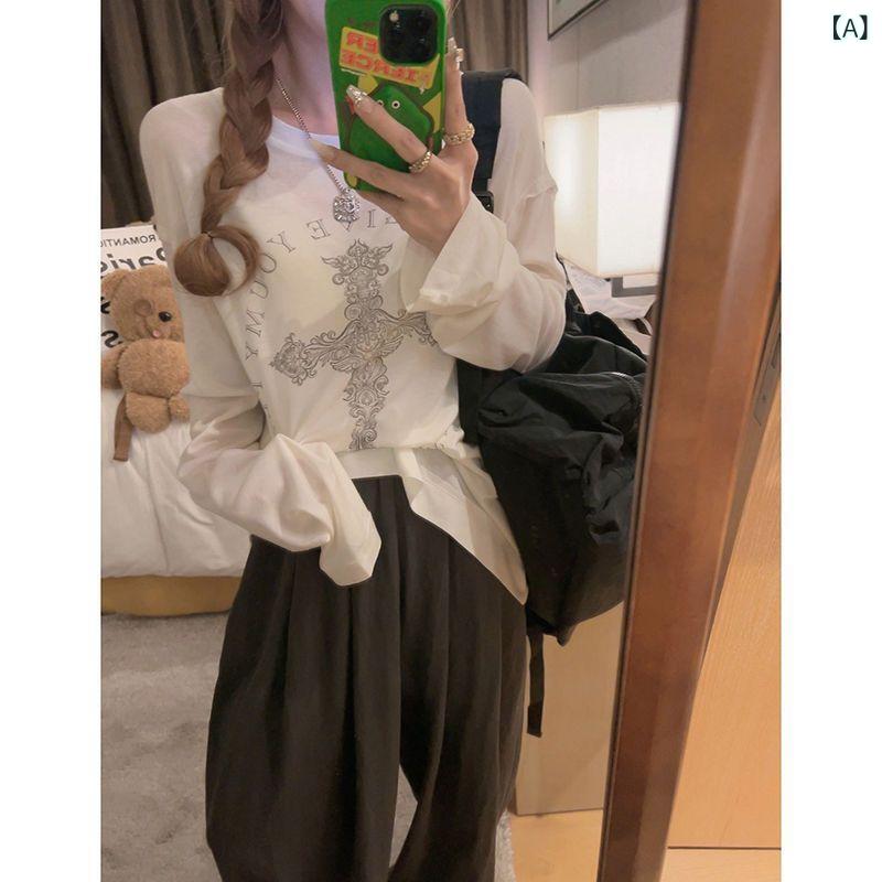 クロスの プリントの 小さい 透き通った 丸首の 長袖の t シャツの 女性の 夏の 薄い 金の 韓国 版の ゆったり して いる 百 合の 白い 日よけの 上着