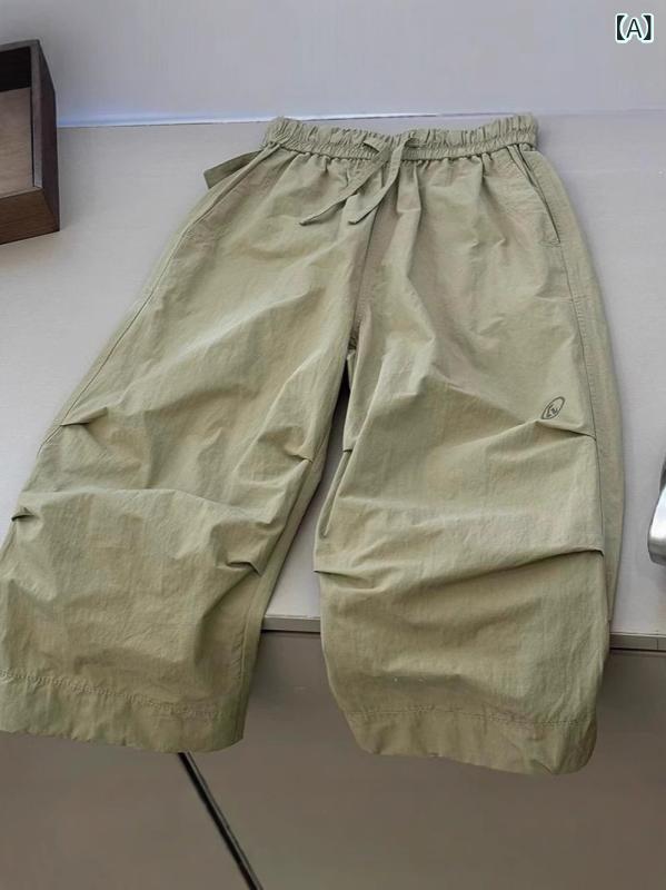 男の子の クールな ハンサムな 韓国 系の 広い 足の 服装の ズボンの 赤ちゃんの 2025 春の 服装の 新型の 中で 大きい 子供の 百 合の ゆったり して いる 運動の ズボン