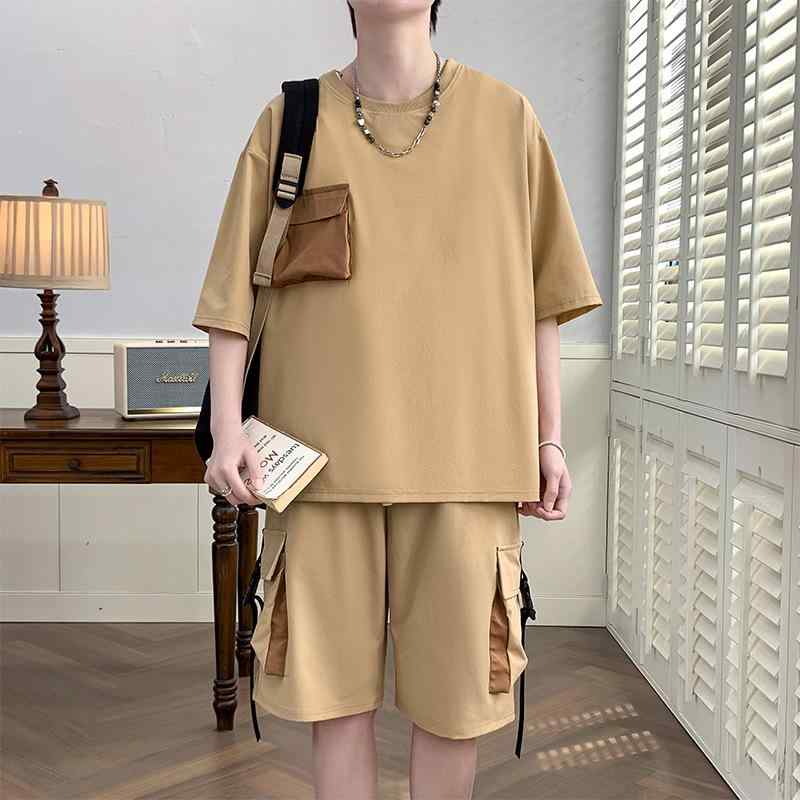 男性の 夏の レジャー スポーツ スーツは シンプルで、 ゆったり した 半袖 ファッションカジュアルスーツの 男性 パンツです。