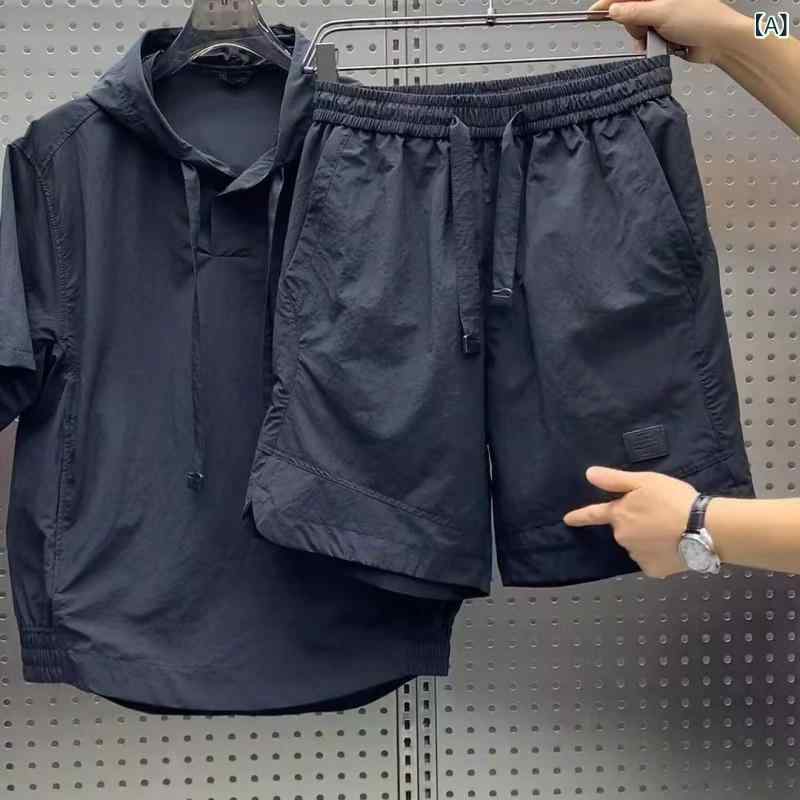 夏の 薄い タイプの 速 乾の 帽子の 半袖の半 ズボンの カップルは ゆったり して います。