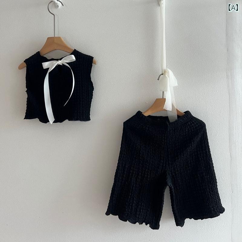 女の子の純 色の スーツの 新型の 夏の 女の子の 薄い 綿の かわいい 蝶結びの ベスト t シャツの 広い レギンスの スーツ
