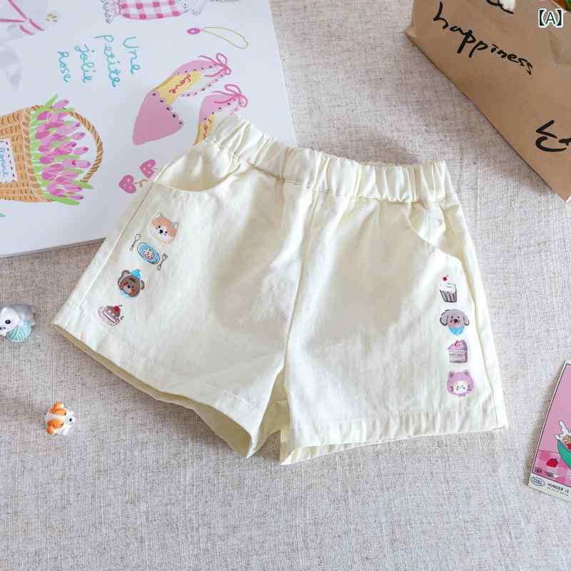 女の子の 夏の ショート パンツ、 ベビー スタイル、 子供 用 パーソナライズ さ れた トレンディな ブランド、 韓国 風の 漫画の プリント、 新鮮で ファッショナブルな インターネットセレブの ホット パンツ