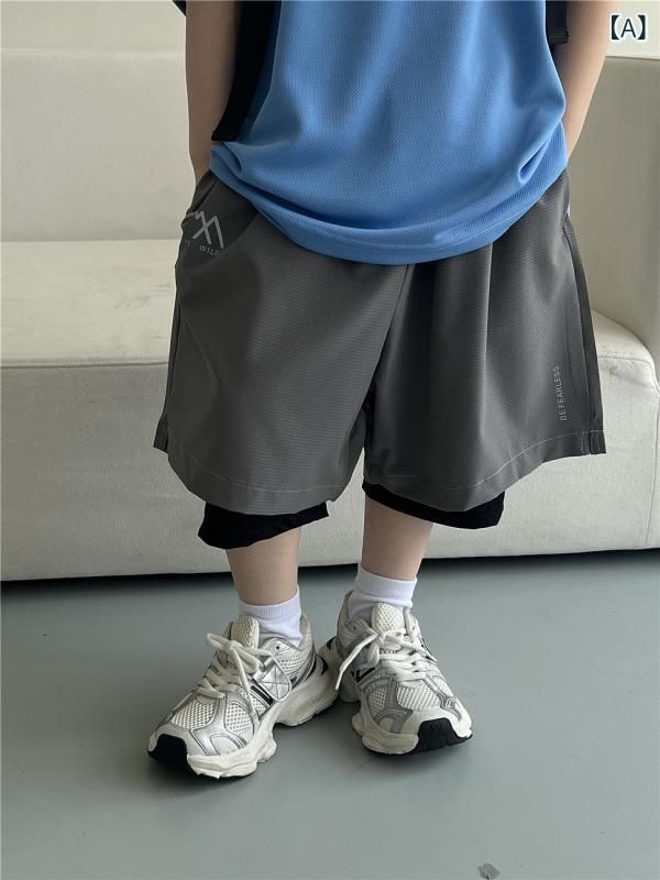 25 夏の 子供の 速 乾の 運動の半 ズボンの 潮の 項の 偽の 2つの 通気 性の 屋外の 訓練の 男女の 子供の 洋 気の半 ズボン