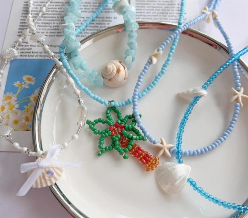 ヤシの木 ネックレス レディース 女性用 シェル ビーズ 鎖骨 チョーカー ヒトデ リボン さざれ石 モチーフ 青 リゾート バカンス ビーチ 海辺 ボヘミアン 個性的 ユニーク カジュアル 普段使い 春夏 ペンダント