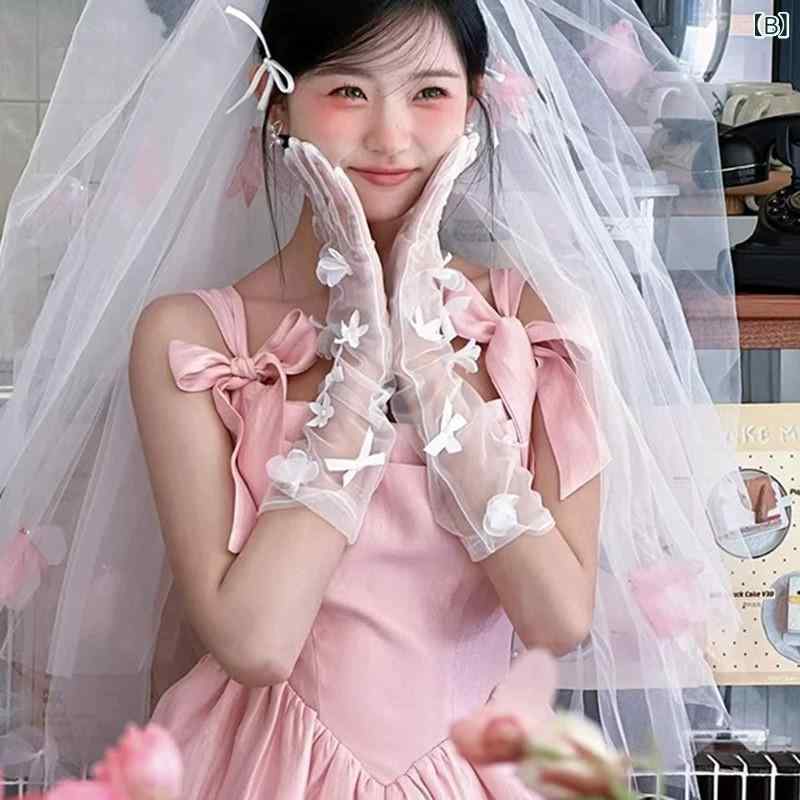 手袋 レディース ウェディンググローブ ブライダル 結婚式 披露宴 前撮り メッシュ チュール 透け感 伸縮性 リボン 蝶結び プリンセス かわいい エレガント シンプル ミディアム丈 ピンク 春夏 秋冬