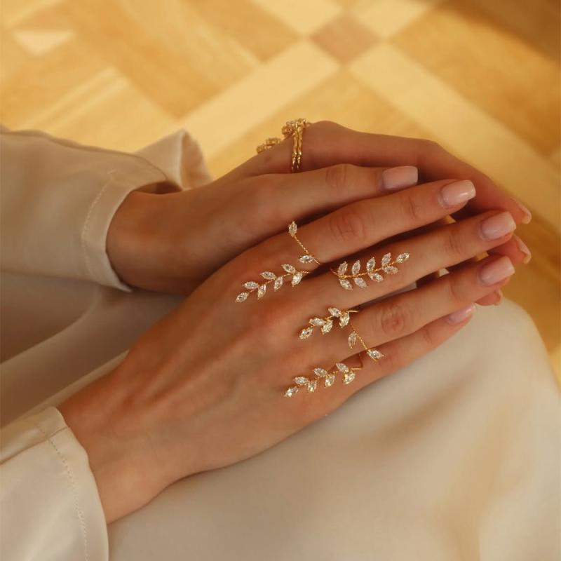 指輪 レディース ブレスレット 一体型 ハンドチェーン リンクリング ジルコニア 春夏 リーフ 葉 植物 花 フラワー 電気メッキ加工 シルバー ゴールド 欧米風 通勤 オフィス カジュアル アクセサリー 上品 華奢 手元 飾り 輝き 清楚 豪華
