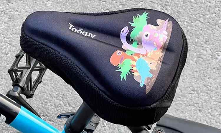 Child'S Bike - 自転車 サドルカバークッション キッズ 男の子 女の子 シリコン 厚手 ソフト 快適 黒 ピンク 青 動物 恐竜 楽園 プリンセス柄 かわいい 防水