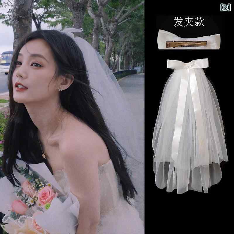 フロントップ楽天市場店のウエディングベール レディース 結婚式 披露宴 前撮り ホワイト リボン ショート チュール 髪飾り ヘッドドレス ブライダル小物 欧米風 高級感 花嫁 撮影用 ヘアコーム ヘアクリップ 春夏 かわいい エレガント 上品 清楚 フォーマル｜アングル3