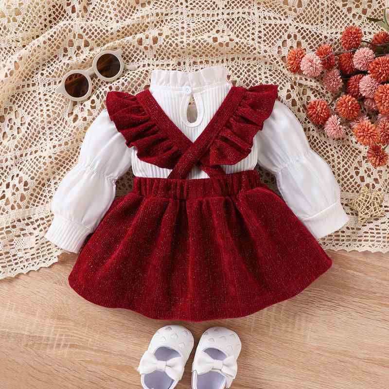 ・カテゴリ: 子供服セットアップ・性別: 女の子・スタイル: 欧米風・セット内容: スカートセット・セット点数: 2点セット・対象年齢: 1〜3歳（身長80〜100cm）・袖丈: 長袖・加工: ソフト加工・柄: 無地・要素: サスペンダー、リボン、欧米風・主な素材: 綿 65%・着脱方式: プルオーバー・カラー展開: レッド・サイズ展開: 3-6M、6-9M、9-12M、12-18M、18-24M