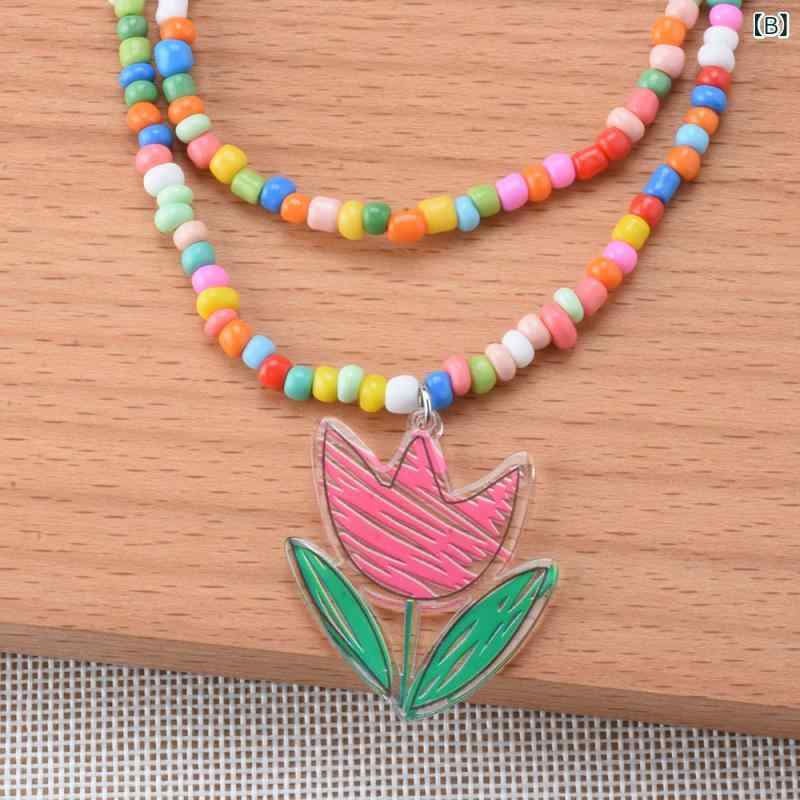 フロントップ楽天市場店のネックレス レディース ボヘミアン エスニック レジン フラワー 花モチーフ ペンダント 二連 ビーズ カラフル 華やか 電気メッキ加工 合金 普段使い パーティー 秋冬 アクセサリー 首飾り 欧米風 かわいい 高級感｜アングル3