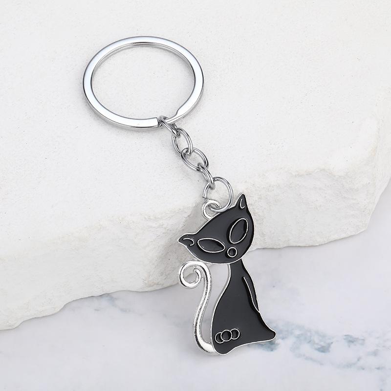 ・カテゴリ: キーホルダー・素材: 亜鉛合金・カラー展開: 黒猫、白猫、黒猫+白猫・スタイル: 現代アート