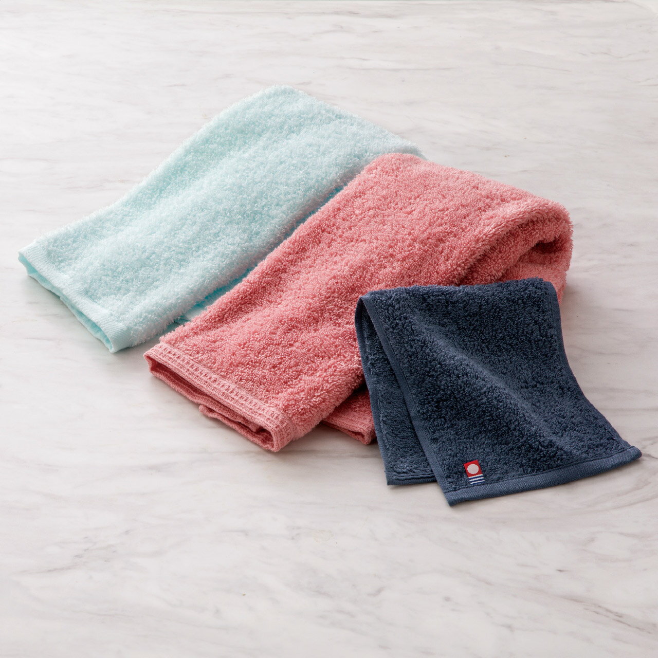 香典返し お供え 御供 仏事 弔事 法要 法事 [ ダディボーイ ハーフバスタオル コーラルピンク ]お返し 返礼 返礼品 粗品 粗供養 満中陰志 御霊前 命日 一周忌 三回忌 49日 四十九日 志 偲草 贈答用