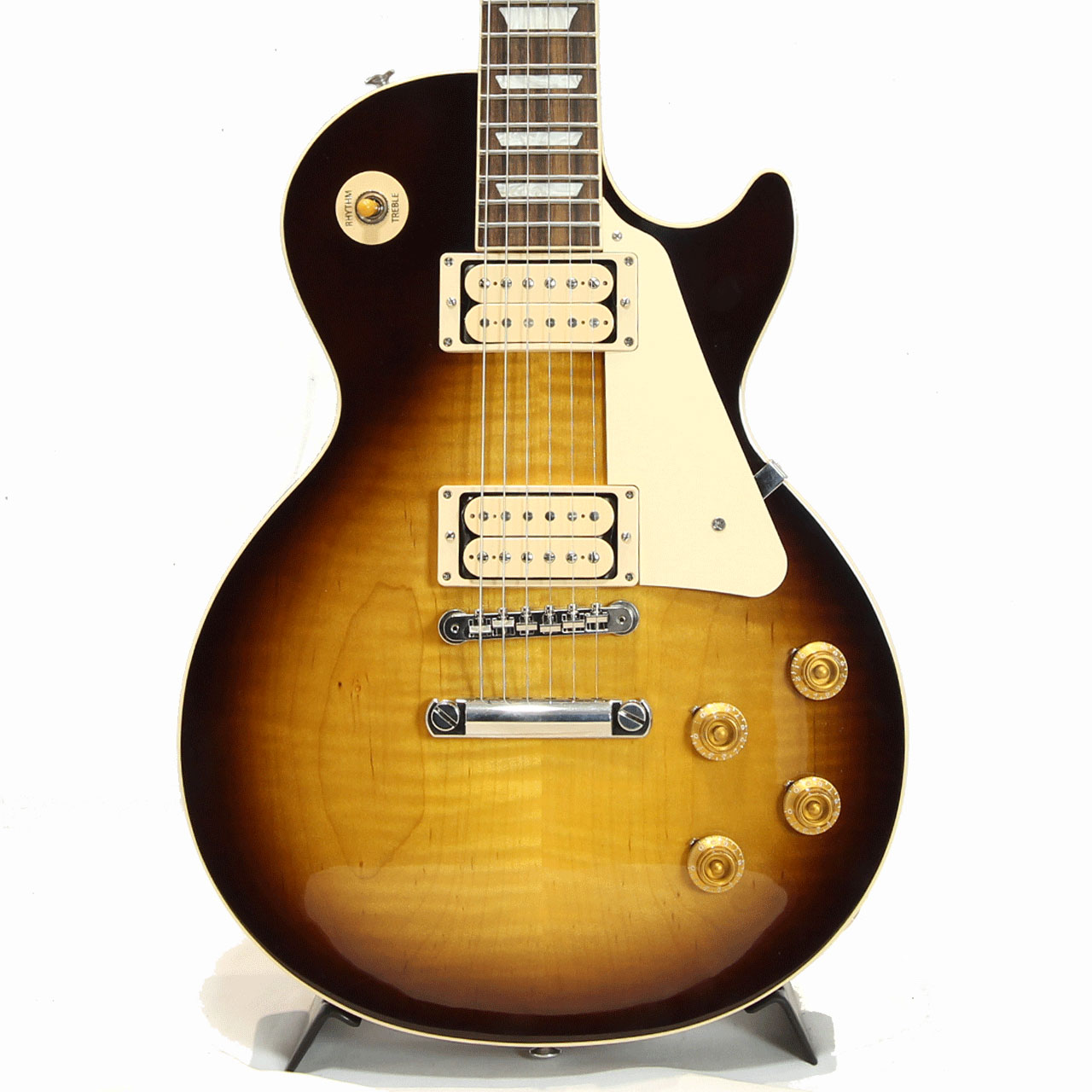 往年のクラシックデザインを踏襲したLes Paul Standard。世界限定500本としてリリースされた本機はオープンタイプのダブルクラシックホワイトのボビンのピックアップが2基搭載した1本。更に塗装にはニトロセルロース・ラッカー・フィニッシュのヴィンテージ・カラー・バリエーションを採用し年月を経て自然に生じる経年変化の風合いを再現しています。 ノンウエイトリリーフの完全ソリッドボディのマホガニーボディにメイプルトップ、マホガニーネックにローズウッド指板。Vintage 50sの丸みのあるグリップは握り込んで演奏するのに程よい太さです。 ABR-1ブリッジやアルミテールピース、キーストーンペグボタン、ハンドワイヤリングアッセンブリーやオレンジドロップキャパシター採用などヴィンテージらしい往年のギブソントーンを存分に堪能いただける仕上がりです。 ピックアップにはキャリブレートされたBurstbucker1＆2のダブルクラシックホワイトを搭載しレスポールならではの甘く重厚なトーンを生み出してくれます。歪みでは分厚さの中に輪郭がしっかりあるサウンド。ラウドな歪みにもぶれないボトムは雑味を残さない粘りとソリッドさを持ち合わせています。 ノンカバード特有のバイト感をオープンレンジなトーン、そしてダブルホワイトが持つ独特のルックス、そしてそれを最大限引き立てる風合いも持つ本モデルのために用意されたフィニッシュ。限定モデルに相応しい仕上がりとなっております。お早めにどうぞ!! Weight : 4.155kg ハードケース付属 撮影環境、パソコン環境により色味は異なる場合もありますが、杢目は画像の商品でのお届けとなります。 他のサイトでも販売しています。買い物かごに入れても売り切れの場合がございますのであらかじめご了承下さいませ。 Body Body Material : Mahogany Top Material : Maple Weight Relief : None Finish : Gloss Nitrocellulose Lacquer Neck Neck Material : Mahogany Neck Profile : Vintage 50s Scale Length : 24.75" / 62.865cm Fingerboard Material : Rosewood Fingerboard Radius : 12" / 304.8mm Number of Frets : 22 Frets : Medium Jumbo Nut Material : Graph Tech Nut Width : 1.695" / 43.05mm End-of-Board Width : 2.26" / 57.4mm Inlays : Acrylic Trapezoids Hardware Finish : Nickel Bridge :ABR-1 Tune-O-Matic Tailpiece : Aluminum Stopbar Tuners : Vintage Deluxe w/ Keystone Buttons Pick Guard : Cream Control Knobs : Aged Gold Tophat w/ Pointers Switch Tip : Amber Switch Washer : Cream Jack Plate : Cream Electronics Neck Pickup : Burstbucker 1 Bridge Pickup : Burstbucker 2 Controls : 2 Volumes, 2 Tones &amp; Toggle Switch (Hand-wired with Orange Drop Capacitors) &nbsp;