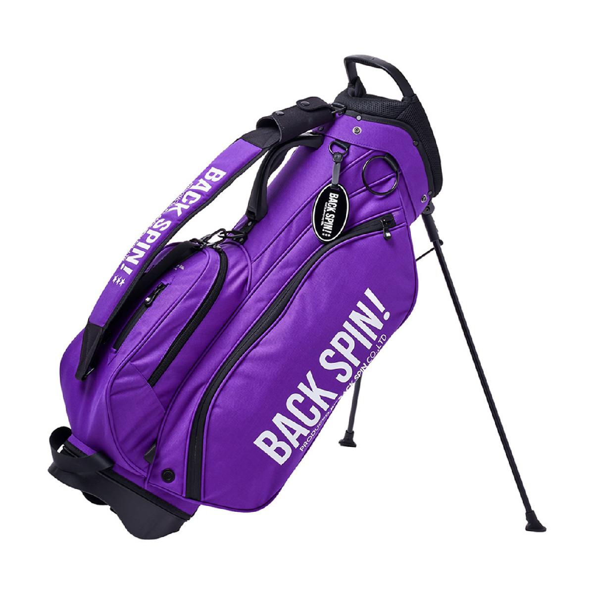 スタンドキャディバッグバックスピン / BACK SPIN!商品の特徴BACK SPIN！初！8.5インチ口径のコンパクトなスタンドキャディバッグが登場。生地は1000デニールのナイロン仕様。撥水加工、高強度、耐摩耗性があり、引き裂けにも強く軽量です。差し色が目を惹くブラック×オレンジ、ビビッドなピンク、パープル、オレンジを取り揃えております。おそろいのカートバッグやヘッドカバーと合わせてお楽しみください。【蛍光色生地ご使用上の注意事項】・本製品は蛍光色を使用しているため、直射日光や紫外線に長時間さらすと退色する場合があります。・高温多湿や直射日光を避け、暗所で保管してください。型8.5型対応長さ47インチネームプレート有り(名入れサービス無し)口枠5分割セパレート3分割タイプスタンド素材ナイロン重さ約3kg対象ユニセックスシーズン2025年モデル製造国中国25fwacc