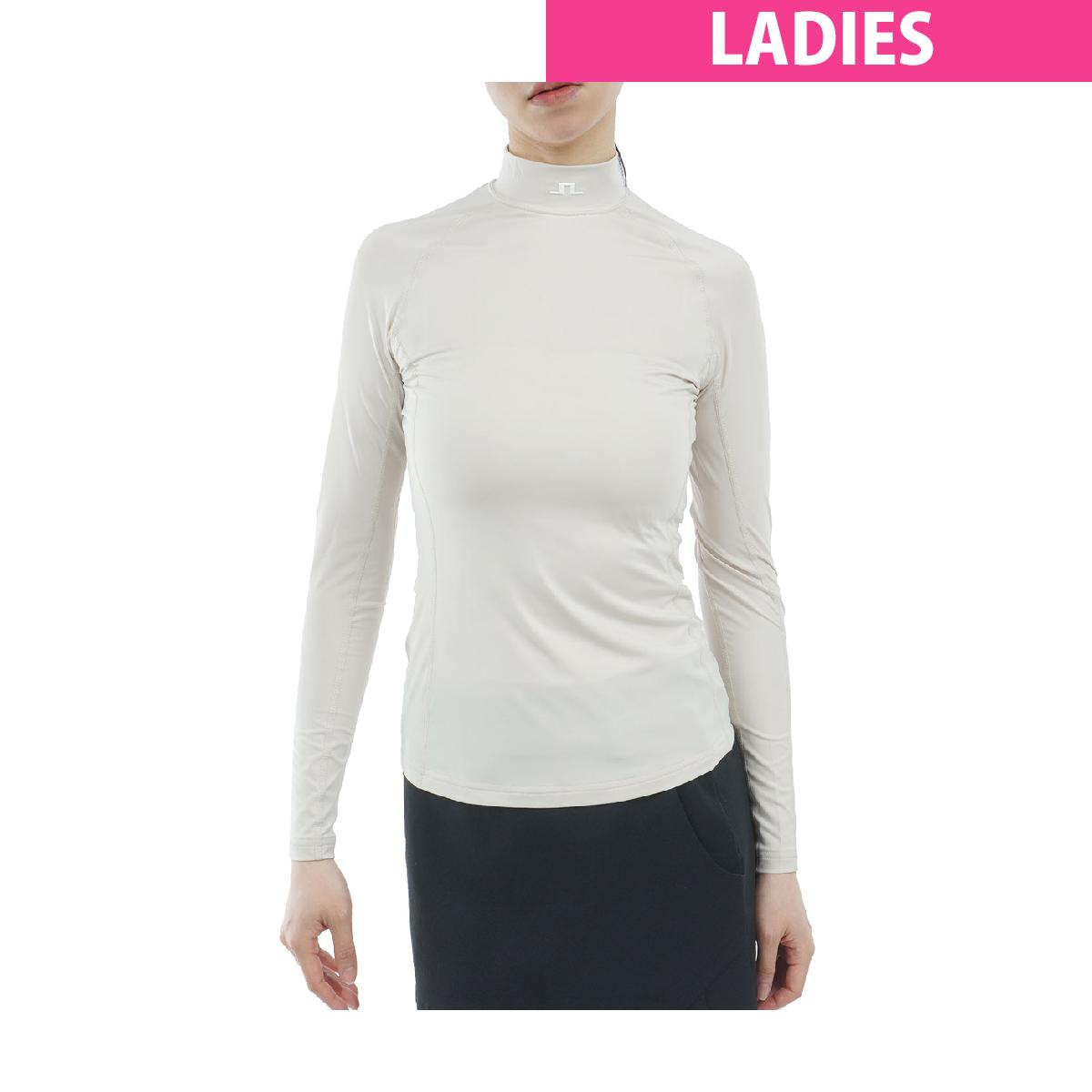 Ella Compression ハイネック長袖シャツJ.リンドバーグ / J.LINDEBERG商品の特徴Ella Compression Top、柔らかな圧縮素材が肌に心地よくフィットし、優れた通気性を実現。UVカット機能を備え、日差しの中でも安心してプレーを楽しめる。中央に配置されたブリッジロゴと袖のJ. Lindebergテキストが、洗練された印象を与える。計算されたシルエットがすっきりとしたスマートな佇まいを演出し、動きやすさを追求したデザイン。プレーへのモチベーションを高める、内面から溢れる自信を引き出す逸品。素材ポリエステル88％、ポリウレタン12％洗濯仕様手洗い可、ドライ不可サイズバリエーション38、40対象レディス製造国ベトナムシーズン2026年春夏モデル【GDO計測実寸値】(cm)38:着丈58.5、ゆき丈69、身幅3840:着丈59、ゆき丈70、身幅40.5※伸縮素材やデザインによってメーカー公表推奨サイズより実寸値が小さい場合がございます。※実際に採寸した数値を掲載しております。商品タグにはメーカー推奨サイズ（想定しているボディサイズ）が記載されており、実寸とは異なりますのでご注意ください。【実寸計測箇所】着丈 ：後ろ襟ぐり（襟の付け根）中央から後身頃裾口までの長さゆき丈：後ろ襟ぐり（襟の付け根）中央から肩先を通り袖口までの長さ身幅 ：脇部袖の付け根左右両端の長さウエスト(A)：履き口左右両端の長さを2倍ウエスト(B)：内股合わせ（※）から股上前面へ20cmの地点の左右両端の長さを2倍ヒップ ：内股合わせ（※）から股上前面へ15cmの地点の左右両端の長さを2倍股上 ：内股合わせ（※）から履き口上端までの長さ股下 ：内股合わせ（※）から内股の縫い目に沿った裾口までの長さわたり幅 ：内股合わせ（※）から水平方向に外側へ端まで結んだ長さ(※)パンツの股部分の左右の分かれ目の起点※GDO独自の採寸方法により計測を行っておりますため、多少の誤差が生じる場合がございます。ssnew