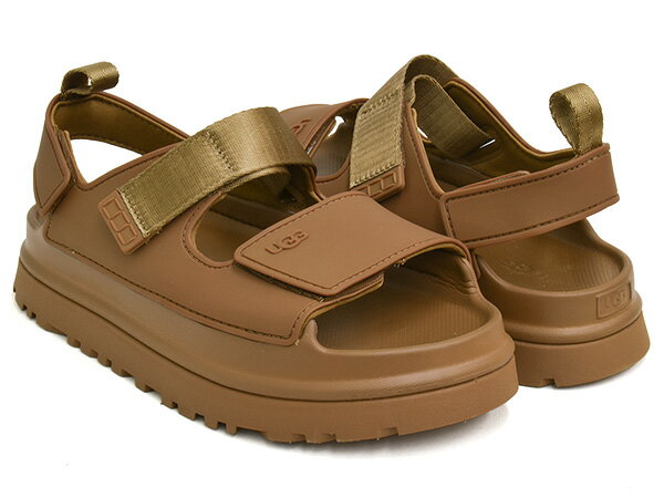 ●ATTENTION ■在庫について こちらの商品は実店舗と在庫を共有しておりますので、売り違いが生じる事がございます。予めご了承下さい。UGG KIDS' GOLDENGLOW #1152813k-brwn BISON BROWN 1978年にオーストラリア人のサーファーが南カリフォルニアで立ち上げたブランド"UGG"。ブランドを象徴するシープスキンブーツが、海上がりに裸足でそのまま履けるシューズとしてサーフシーンで人気を博し、2000年代になるとメディアがこぞって取り上げ、セレブの着用も相まって大流行したことで、ファッションシーンでも確かな地位を築いたブランドです。 今作は軽量で快適なストラップサンダル"GOLDENGLOW"。スタイルアップ効果も期待できる厚底デザインながら、水に強いTPUアッパー、フィット感を調整できる前後のストラップ、クッション性に優れたサトウキビ由来のEVAソール等、機能性もしっかり備えた一足です。 CONNECT: ORDER: