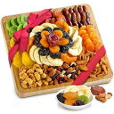 A Gift Inside Dried Fruit and Gourmet Snacks Gift on Bamboo Cutting Board Servin...
