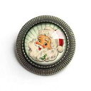 緑の背景のレトロなサンタ ホリデー ブローチ The Divine Iguana Retro Santa on Green background Holiday brooch