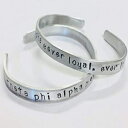 Theta Phi AlphaAɒŉiIȁATPA nhX^v̈puXbgAϐFȂA~jẼJtACZX Theta Phi Alpha, ever loyal, ever lasting, TPA handstamped quote bracelet, on a nontarnish aluminum cuff, of