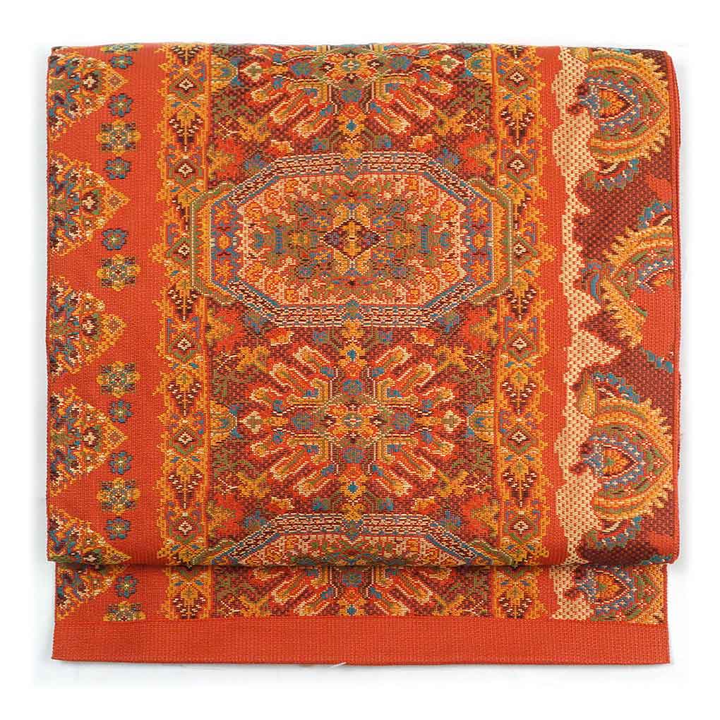 【中古】名古屋帯 リサイクル着物 幅31cm 長さ358cm レディース 連続模様 秋冬春用 正絹（シルク）オレンジ地 未使用品 リメイク リユース