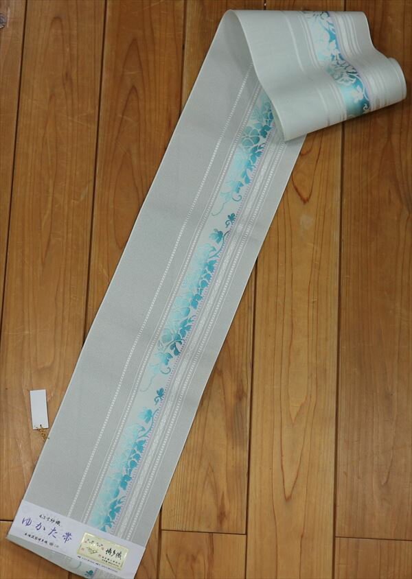森博多織株式会社謹製 婦人ゆかた帯淡い水色地に太縞 細縞が美しく描かれ太い縞には同系濃色の草花が涼しさを醸し出しています！おしゃれなゆかた帯ですね yukao93463-052