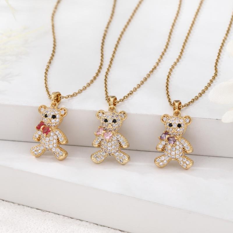 ネックレス レディース クマ テディベア 鎖骨チェーン ショートネックレス ラインストーン ペンダント 高級感 繊細 妖精風 フェミニン 銅製 ピンク レッド パープル 蝶結び キラキラ かわいい 清楚 エレガント 首飾り デート お出かけ