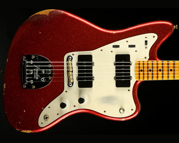 Description 1987年に設立され、最上級モデルを制作するために生まれたフェンダー・カスタム・ショップ（Fender Custom Shop）。マスタービルダーと呼ばれる巨匠達が製作を担当するマスタービルダー・シリーズやその他の多くのシリーズで厳選された木材選び、ピックアップのコイル巻きなど高い製作技術で作り上げられております。フェンダー社の長年の歴史と伝統が注ぎ込まれた世界中のミュージシャンから愛され続けるセクションです。 2021年の限定モデル「LIMITED EDITION CUSTOM JAZZMASTER RELIC」のリ・オーダー品のご紹介です。ボディには低～高音域までクセの無い厳選された2ピース・アルダー、25.5インチ・スケールのネックと21フレット仕様の指板には硬めでクリアかつ歯切れの良いリフトソウン・メイプルを採用。ネックシェイプは手に馴染みやすく握り込み易い「1957 Soft “V”」を採用し、6弦を親指で弾くプレイヤーにとって理想的と言え、フレットには通常のヴィンテージ・サイズより大きい「Medium Vintage」、指板にはローポジションからハイポジションに掛けて抜群の演奏性をお約束するコンパウンド・ラディアスをセレクトするなどストレスを感じることなくスムーズなフィンガリングを可能にいたします。 ピックアップ・システムにはカスタムショップにて丁寧にハンドワウンド（手巻き）された「Jazzmaster」を搭載し、P-90に近似する構造のオリジナルピックアップで、P90タイプならではのアタック感とクリアなサウンドは、単音＆和音問わず自由自在なプレイを可能にいたします。またブリッジには「RSD Jaguar/Jazzmaster」を搭載し、しっかりと溝を確保した重厚感のあるブラスサドルを配置することで、弦落ちを防ぐ利点とともに太く豊かな倍音をアウトプット。さらにアノダイズド処理が施されたアルミ板を切り出して製作されたゴールド・ピックガードが非常に印象的で、ルックスにアクセントをプラスし、ダイナミックでパワフルなトーンに影響を与えております。エイジング処理は塗装が剥げて来た絶妙な風合いを演出する圧巻のレリック加工はさすがはカスタムショップと言うに相応しい出来映えです。そしてヘッド裏に『LIMITED EDITION』と入ったロゴ・デカール、『LIMITED EDITION』と刻印されたジョイント・プレートなどさり気ない限定感も見逃せません。ステージ映えは間違いなし、お薦めの限定ジャズマスターとなっております。 Specification Body Shape: Jazzmaster Body Material: 2-Piece Select Alder Body Finish: Nitrocellulose Lacquer Neck Material: Rift Sawn Maple Neck Shape: 1957 Soft "V" Scale Length: 25.5" (648 mm) Fingerboard Radius: 7.25" to 9.5" Vintage Compound Radius (184 mm to 241 mm) Number of Frets: 21 Fret Size: Medium Vintage String Nut: Bone Nut Width: 1.650" (42 mm) Truss Rod Nut: Vintage-Style Slotted Neck Plate: 4-Bolt "Limited Edition" Engraved Neck Finish: Nitrocellulose Lacquer Fingerboard: Flat-Laminated Rift Sawn Maple Position Inlays: Micarta Black Dot Bridge Pickup: Custom Shop Hand-Wound Jazzmaster Middle Pickup: N/A Neck Pickup: Custom Shop Hand-Wound Jazzmaster Controls: Lead Circuit Controls (Slide Switch Down): Master Volume, Master Tone; Rhythm Circuit Controls (Slide Switch Up): Two Thumbwheel Controls for Neck Pickup Volume and Tone Pickup Switching: 3-Position Toggle: Position 1. Bridge Pickup, Position 2. Bridge and Neck Pickups, Position 3. Neck Pickup Pickup Configuration: SS Bridge: RSD Jaguar/Jazzmaster Tuning Machines: Vintage-Style Orientation: Right-Hand Hardware Finish: Nickel/Chrome Pickguard: 1-Ply Gold Anodized Aluminum Control Knobs: Knurled Flat-Top Strings: Nickel Plated Steel (.010-.046 Gauges) Included Accessories: Deluxe Hardshell Case, Strap and Certificate of Authenticity.