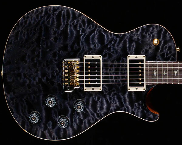 Description 安定したバランスを備えたデザイン、高い演奏性を誇る製作技術、クオリティの高いサウンドにより「第三のブランド」と名高いポールリードスミス。元CREEDのギタリストとして活躍するマーク・トレモンティのシグネチャー・モデル「Mark Tremonti」のご紹介です。 今回ご紹介するのは"Wood Library"と呼ばれるストックルームより厳選された高級木材を使用した特別な1本。トップに極上"10-Top"のキルテッド・メイプルを贅沢にセレクトし、バックには中音域豊かで上品な甘いトーンをアウトプットするマホガニー、25インチ・スケールのネックにはフレイム杢が美しく硬めでクリアかつ歯切れの良いフィギュアド・メイプル、22フレット仕様の指板には倍音豊かで優れたサスティーンを生むインディアン・ローズウッドを採用。ネック加工技術には2011年からのニュースペックである"Pattern"シリーズのネックシェイプを採用し、3種類のバリエーションには「パターン」「パターン・レギュラー」「パターン・シン」プレイヤーの手に合わせた形状へと変更されております。「Mark Tremonti」はテクニカルなプレイヤーに標準を合わせ製作されたパターン・シン（Pattern Thin）になりますので、薄めで僅かにワイドなグリップによりスムーズなフィンガリングを可能にいたします。 ピックアップ・システムには2基の「Tremonti」を搭載し、ファットな中低音域が特徴的で厚みのあるサウンドをアウトプット。このピックアップは本人のために巻き数を変えたコイルを採用し、カスタムされた強力なマグネットも採用するなど、ロック・サウンドを演出するのに最適な非常にアグレッシブなピックアップです。ペグにはロッキング式チューナー「PRS Phase III」を搭載しスピーディーな弦交換をお約束。ブリッジには非常に定評のあるPRSトレモロを進化させた「Gen III Tremolo」を搭載し、ボディと接着している6本のネジは太くなりブリッジサドルの溝は深く削られ、弦のあたる部分を非メッキのままにすることにより豊かな倍音とサスティーンに貢献しております。様々なプレイヤーから愛される取り回しの良いトラディショナルなシングルカット・ボディ、2ボリューム、2トーン、3ウェイセレクターなど伝統を重んじたプレイヤーを選ばない、まさにプレイアビリティ溢れる設計。あまりシグネチャー・モデル感が強くありませんので、どなたでもお使い頂けるモデルかと思われます。ファンにはたまらない本人の拘りが詰め込まれたモデルに仕上がっております。 Specification Top Wood: 10 Top Quilted Maple Back Wood: Mahogany Number of Frets: 22 Scale Length: 25" Neck Wood: Figured Maple Neck Neck Shape: Pattern Thin Fretboard Wood: East Indian Rosewood Fretboard Inlay: Abalone J-Birds with Mother of Pearl Birds Bridge: PRS Patented Gen III Tremolo Tuners: PRS Phase III Locking Tuners Hardware Type: Hybrid Treble Pickup: Tremonti Bass Pickup: Tremonti Controls: Volume and Tone Control for Each Pickup and 3-Way Toggle Pickup Selector Strings: 10's※海外代理店との規定により中古品表示しております。状態は新品です。