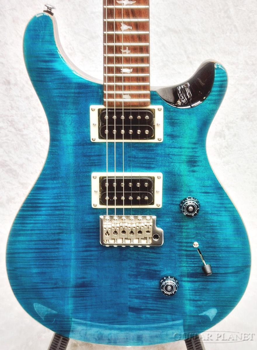 SE Custom 24は、オリジナルのPRSデザイン・プラットフォームを、高品質でお求めやすい価格帯のSEシリーズに導入した1本。 ツアー・アーティストやライブの多いミュージシャンなどから愛用されているSE Custom 24は、マホガニー・バック＋メイプル・トップのボディ、Wide Thinカーブのメイプル・ネックにローズウッド指板＋バード・インレイを合わせ、PRSデザインのトレモロ・ブリッジを装備。 85/15 “S”ピックアップに1ボリューム、プッシュ/プル・タイプのトーン・コントロール、3ウェイ・ブレード・ピックアップ・セレクターによる多彩なサウンド。 クラシカルな中にモダンさを兼ね備え、高い耐久性、病みつきになるほどのプレイアビリティ、そして多彩なトーンの「使える」1本です。 SPEC Top Wood: Maple with Maple Veneer Back Wood: Mahogany Number of Frets: 24 Scale Length: 25 Neck Wood: Maple Fretboard Wood: Rosewood Neck Shape: Wide Thin Fretboard Inlays: Birds Bridge: PRS Patented Tremolo， Molded Tuners: PRS SE Tuners Hardware Type: Nickel Treble Pickup: 85/15 S Bass Pickup: 85/15 S Pickup Switching: Volume and Push-Pull Tone Control with 3-Way Blade Switch /_/_/_/♪出荷前調整のご要望承ります♪_/_/_/_/ ギタープラネットではご注文頂いた商品は 新品中古問わず検品・調整してから出荷致します。 弦高などの細かなセッティング等、お好みに 合わせての調整も可能ですので、お気兼ねなく お申し付けくださいませ。 /_/_/_/_/_/_/_/_/_/_/_/_/_/_/_/_/_/_/_/_/_/_ ※当商品は通信販売に限りご用意が可能でございます。実店舗での実機確認・試奏はお受け出来ませんので予めご了承ください。 ※掲載画像はサンプルになります。実際にお届けする商品とは色味や木目が異なる場合がございますのでご了承ください。 お問い合わせ:03-3259-0031　
