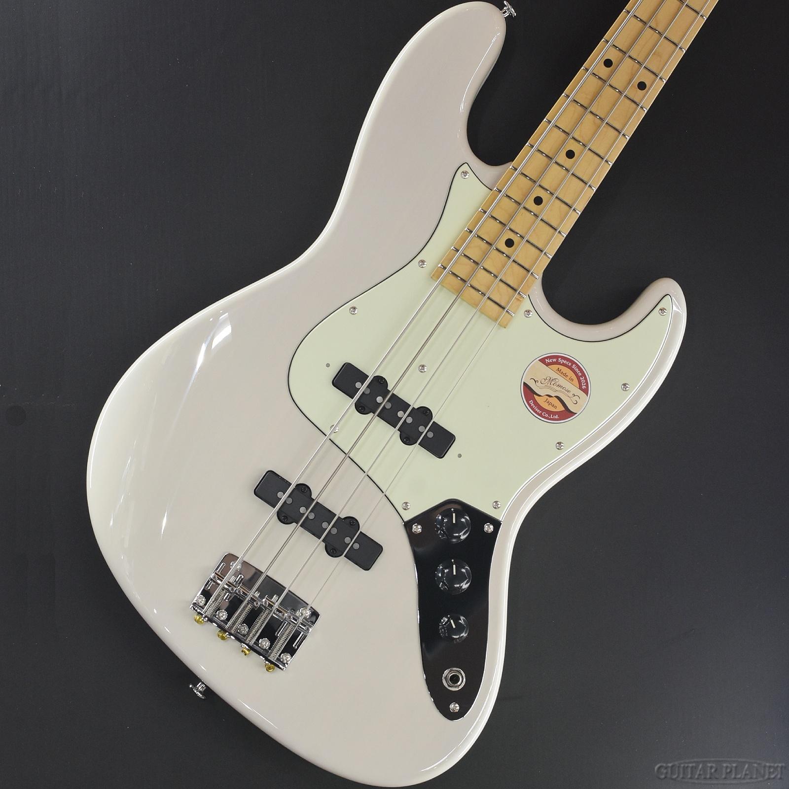 2002年の設立以来、日本のクラフトマンシップを体現するブランドとして高い評価を築いてきた Momose Custom Craft Guitars。 伝統的なスタイルを忠実に継承しながらも、単なるヴィンテージコピーに留まることなく、独自の設計思想と現代的なスペックを取り入れた楽器製作を一貫して続けてきました。 そのMomoseが、長年培ってきた技術と経験をもとに、2026年に待望のリニューアルを実施。従来の魅力を再定義し、次世代のスタンダードとして提案するシリーズへと進化を遂げています。 今回ご紹介するのは、トラディショナルなスタイルを基盤としながら、Momoseならではの解釈でブラッシュアップを施したオリジナルシリーズ 「MJ」。 木工、塗装、組み込みに至るまで、熟練職人の手作業によって丁寧に仕上げられるその楽器は、完成度の高さと優れたプレイアビリティによって、国内外の幅広いプレイヤーから支持を集めています。リニューアル後のMJシリーズは、従来モデルの良さを継承しつつ、細部に至るまで再設計が施された意欲作と言えるでしょう。 本機 MJ2 は、アッシュボディ、メイプルネック、メイプル指板というウッドマテリアル構成を採用。低音のパンチのあるサウンドと高音域のシャープさを併せ持つサウンドで、全体のバランスに優れたトーンキャラクターが特徴です。 ボディ形状は1弦側カッタウェイを深く取ることで、ハイポジションへのアクセス性を大幅に向上。さらに、ジョイント部には落とし込み式のネックプレートを採用しており、ポジション移動時のストレスを感じさせない設計となっています。 指板サイドにはウッドバインディングを施し、フレットエッジの処理も含めて、非常に滑らかなフィンガリングを実現。フレットには信頼性の高い Jescar製ミディアム・ジャンボフレット を採用しており、適度な存在感と押弦の安定性を両立しています。 指板ラジアスはフラットに近い 310R を採用することで、現代的な演奏スタイルにも対応。コードワークから速いパッセージまで、幅広いプレイに柔軟に応えます。 また、指板サイドのドットポジションマークには蓄光素材を採用しており、暗転したステージ環境においても高い視認性を確保するなど、実用面への配慮も行き届いています。 ピックアップには、2026年リニューアルに合わせて新たに開発されたMomoseオリジナルピックアップ 「Gravitas」 を搭載。 従来モデル VJ-1 と比較しても、重心が低く、より太さと密度を感じさせるサウンドを持ちながら、輪郭の明瞭さをしっかりと保持している点が大きな特徴です。トラディショナルなパッシブサウンドを基調としつつも、現代のアンサンブルにおいて埋もれない存在感を発揮します。 コントロールは2ボリューム、マスタートーンの3ノブ構成としながら、トーンノブをプルアップすることで、2基のピックアップを直列接続する 「ターボスイッチ」 を搭載。これにより、通常のパッシブサウンドから、一段階太く押し出しの強いトーンへと瞬時に切り替えることが可能です。 また、トーン回路には Centralab製オイルコンデンサー を採用し、音の変化が自然かつ音楽的になるよう細部まで配慮されています。 アウトプットジャックには、高いホールド力とローノイズ性能で定評のある Pure Toneジャック を採用。ライブやレコーディングといった実戦環境においても、信頼性の高いパフォーマンスを発揮します。 ヘッド部のペグには、小型・軽量な Gotoh GBU510C-12 を採用することで、ヘッド落ちを抑え、全体のバランスをさらに向上。演奏時の取り回しの良さにも大きく貢献しています。 高いコストパフォーマンスによって支持を集めてきたモデルでありながら、決して現状に甘んじることなく、常に改良と進化を続けるMomoseの姿勢が色濃く反映された 2026年最新モデル。 伝統と革新を高次元で融合させたMJ2は、長く付き合える実用性と、所有する喜びを兼ね備えた一本として、自信をもっておすすめできるモデルです。 是非この機会にご検討ください。 SPEC Body:Ash Neck:Maple Neck Scale:34" Fingerboard:Maple,310R Number of Fret:21,Jescar FW55090NS Pickups:Momose Gravitas-J Set Control:2Vol,1Tone(Pull up: Turbo SW) Case:Gig Bag Weight:3.95kg Serial Number:22015 ※掲載画像は、カメラの特性やディスプレイなどの影響により、実際に肉眼で見える色合いと差がある場合がございます。 当店でご購入頂きましたベース本体は、保証期間問わず無料にて点検・調整いたします。 なお、保証は日本国内での使用に限ります。 Store/Factory Warranty is applied only in Japan. 詳しくは、お気軽にお問合せくださいませ。　