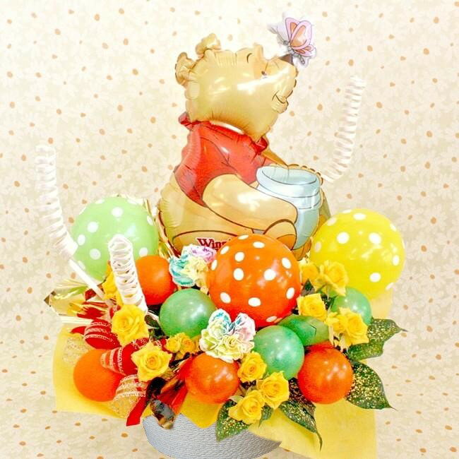 商 品 詳 細 ■商品形態： バルーン付き生花アレンジメント：造花は使用してません■使用花材：&nbsp;メイン:レインボーカーネーション、ミニバラ■商品サイズ：&nbsp;高さ　44cm (バルーン含む)x　幅　約37cm　x　奥行　約35cm■花材について： 出来る限り画像と同じものをお届けいたしますが、入荷都合により多少変更する場合もございますのでご了承くださいませ。■最短お届け日：あす楽対象商品は、決済条件OKの場合、翌日配達可能です。（青森、長崎、宮崎、鹿児島、他一部地域は翌々日となります）お届け時間は確約ではございませんのでご了承下さいませ。■同梱品について： 納品書や領収書等は同封いたしませんのでご必要な場合はご連絡ください。&nbsp;&nbsp;退職 送別 出産祝い 卒業祝い 入学祝い 卒園 にもピッタリなバルーンフラワーギフトです！ &nbsp; 商 品 詳 細 商品形態バルーン＆生花アレンジメント：造花は使用してません使用花材メイン:レインボーカーネーション、その他小花商品サイズサイズ：高さ　44cm (バルーン含む)x　幅　約37cm　x　奥行　約35cm花材について出来る限り画像と同じものをお届けいたしますが、入荷都合により多少変更する場合もございますのでご了承くださいませ。お届け日時あす楽対象商品は、決済条件OKの場合、翌日配達可能です。（青森、長崎、宮崎、鹿児島、他一部地域は翌々日となります）お届け時間は確約ではございませんのでご了承下さいませ。