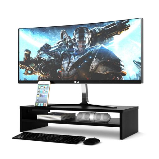 【プレミアム木製 デスク収納スタンド】洗練されたマットブラック仕上げの木製モニタースタンド/PCスタンドが、デスク周りの美観と機能性を一変させます。環境配慮型の高密度MDF材を使用した厚さ12MMの天板は、最大耐荷重30KG(サイズ:540x255x142MM)をしっかりサポート。スタイリッシュな見た目に隠された、本格的な耐久性を備えた卓上モニタースタンドです。 【姿勢を整える、人間工学デザイン】ディスプレイを約14CM上方へ引き上げ、視線を自然な高さに導きます。これにより、うつむき姿勢による猫背や、首・肩への過度な負荷を軽減します。広幅54CMの天板が視界を広く保ち、集中を持続させる、健康に配慮したモニタースタンドです。 【賢い収納でデスクが広がる2段構造】主天板の下に設けられたスペースは、キーボードやノートPCを収納するのに最適。机上からそれらを一掃できるため、本来の作業領域が劇的に広がります。さらに、スマホを立てかけられるスロットと、配線を通す専用開口部を備え、PCスタンドとしての使い勝手を追求しました。 【誰でも簡単、3分セットアップ】面倒な工具は一切不要。