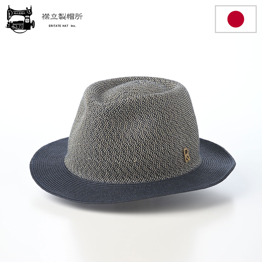 ■別のカラーはこちらブラウンミックス仕様 カラー：ネイビーミックス ブランド：襟立製帽所／日本 素材：分類外繊維（紙）93％、ポリエステル7％ つばの広さ：約4.5～5.5cm 重さ：約110g スベリ絞りアジャスターあり ※サイズを1～1.5cm小さくできます 日本製 着用シーズン：春～夏 ※サイズ調整テープ（長さ30cm）が1個付属します。 ■ サイズの目安 実寸：L:60.5cm 伝統とモダンの融合で独自の価値を生み出すクラフトブランド・襟立製帽所 襟立（えりたて）製帽所は、岡山県浅口市鴨方に拠点を置く、1960年創業の帽子メーカーです。 浅口市の鴨方地域は、古くから麦の栽培が盛んでした。農作業の合間に、余った麦の茎（麦わら）を使って帽子を編む文化が根づき、安価な海外製品の流入により規模が縮小する時代まで、製帽は地域産業の重要な一角を担っていました。 襟立製帽所は、こうした麦わら帽子の産地として栄えた地域性を背景に、長年にわたってものづくりを続けています。創業当初は麦わら帽子の製造を中心としていましたが、時代の変化に対応し、現在では、ROUBOU（ロウボウ）などの自社ブランドにより、帽子の企画・製造・販売までを一貫して手がけています。 特徴は、伝統的な技術と現代的なデザインの融合にあります。中でもブレードハットは、テープ状の素材を縫い重ねながら立体的に成形する高度な技術を必要とし、日本国内でも担い手が限られています。こうした希少な職人技を活かしながら、岡山特産のデニム、倉敷帆布などの地域素材も取り入れた、日常になじむ製品を提案しています。 襟立製帽所は、ブレード帽子の他、キャップ、ハットなど幅広い種類の帽子を展開し、近年はバッグやウェアなどにも領域を広げています。