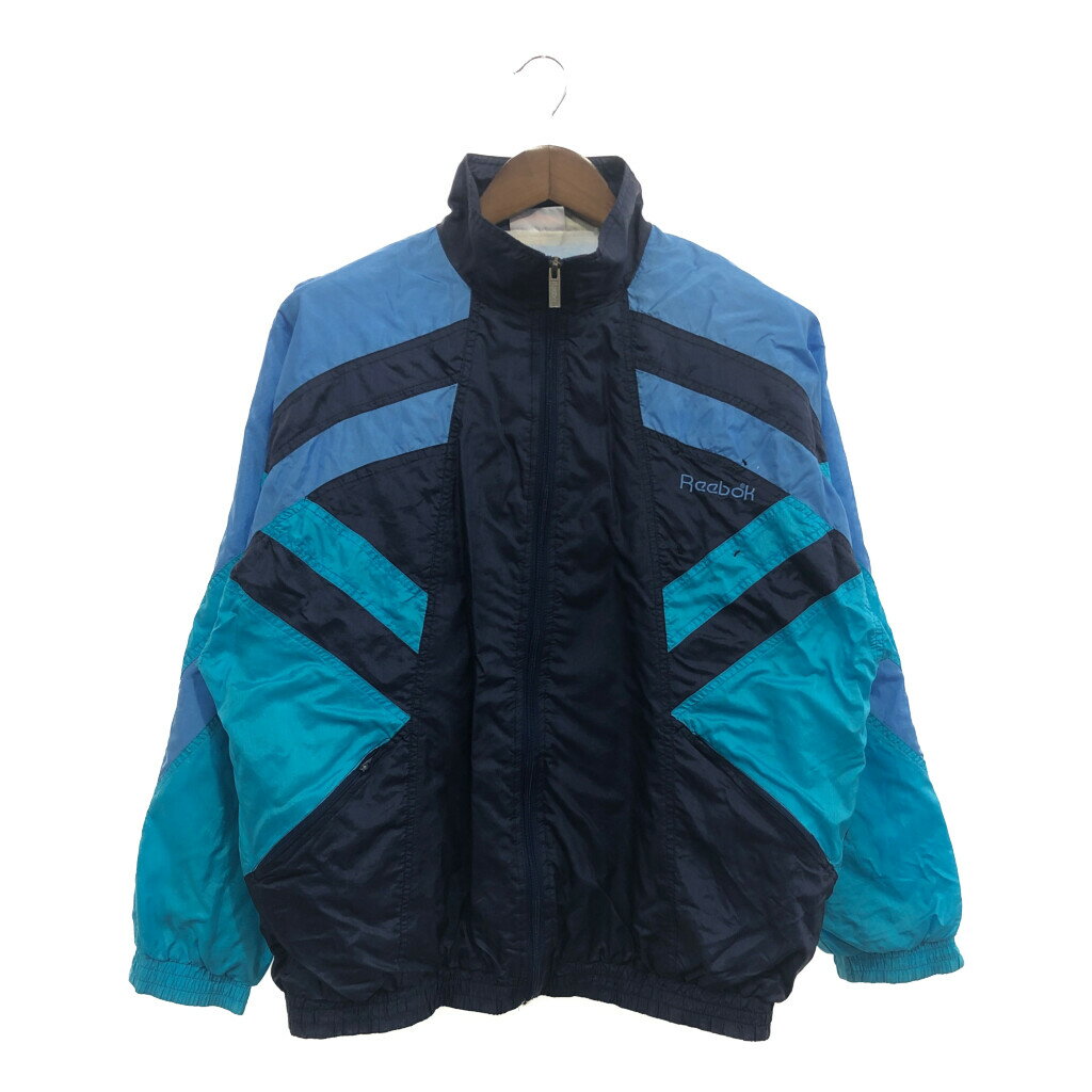 SALE///// Reebok リーボック ナイロン トラックジャケット アウター スポーツ ワンポイントロゴ ブルー (メンズ L相当) 中古 古着 P6286のサムネイル